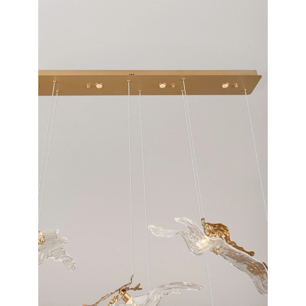 Goldene Pendellampe Avesa mit klarem Glas 128 cm Lyora 5212063500426